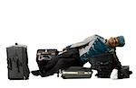 Bellboy lying down on luggage