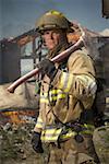 Portrait of a firefighter holding an axe