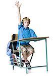 Boy raising his hand in class