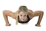 Portrait of a young woman doing push-ups