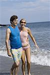 Young couple walking on the beach