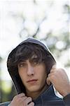 Portrait of a teenage boy wearing a hooded shirt