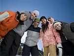 Low angle view of a group of people smiling