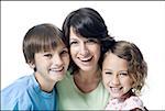 Portrait of a mid adult woman smiling with her son and daughter