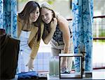 Two young women looking at a window display