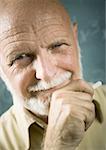 Portrait of a senior male professor holding a chalk