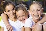 Portrait of three girls smiling