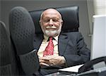 Close-up of a businessman resting in an office