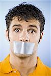 Man with duct tape covering mouth