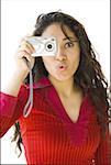 Woman in red shirt taking picture with digital camera