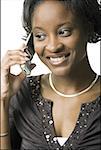 Close-up of a young woman talking on a mobile phone