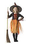 Portrait of a girl dressed as a witch and holding a broom
