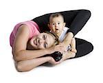 Contortionist mother with baby daughter