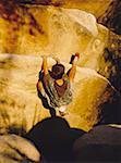 High angle view of a boy rock climbing