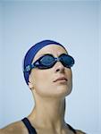 Close-up of a woman wearing swimming goggles and a swimming cap