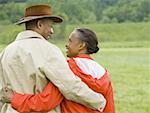 Rear view of a senior man and a senior woman with their arms around each other