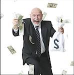 Portrait of a businessman holding dollar bills