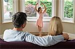 Parents Watching Daughter Performing Ballet