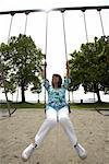 Woman Sitting on Swing