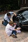 Father and Son Washing Car