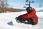 Boy on Ski Hill with Snowboard, Blue Mountain, Collingwood, Ontario, Canada