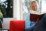 Woman Reading Indoors