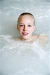 Young woman in jacuzzi at a spa