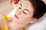 Woman having a facial treatment in a spa