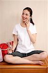 Woman relaxing in locker room after the gym