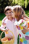 Little boy and girl with Easter egg basket