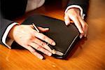 A woman holding an agenda book