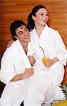 A couple  having a refreshment after a spa treatment