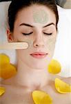 Woman having a facial treatment in a spa