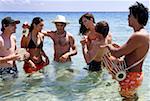 Group of friends in water having fun