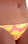 Belly of young woman in bikini