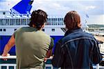 Two men on ferry at dock