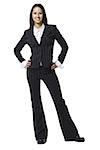 Businesswoman standing with hands on hips smiling