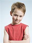 Boy smiling with arms crossed
