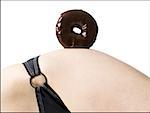 Detailed view of woman in bikini with donut on hip