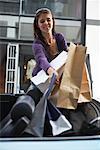 Woman Carrying Shopping Bags to Car