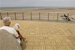 Woman Holding Dog at Beach, Blankenberge, Belgium