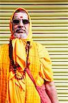 Close-up of a sadhu wearing sunglasses