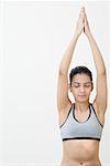 Close-up of a young woman performing yoga