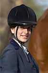 Portrait of a female jockey smiling