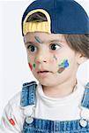 Close-up of a boy with paint on his face