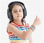 Portrait of a girl wearing headphones and listening to music