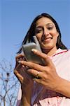 Portrait of a businesswoman using a personal data assistant