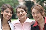 Portrait of three businesswomen smiling together