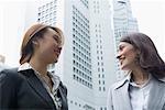 Two businesswomen talking to each other