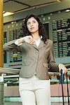 Close-up of a businesswoman waiting at an airport lounge